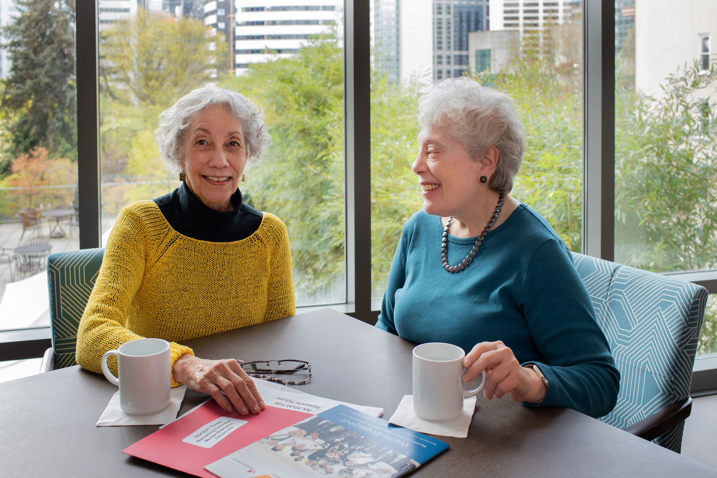 two senior women smiling