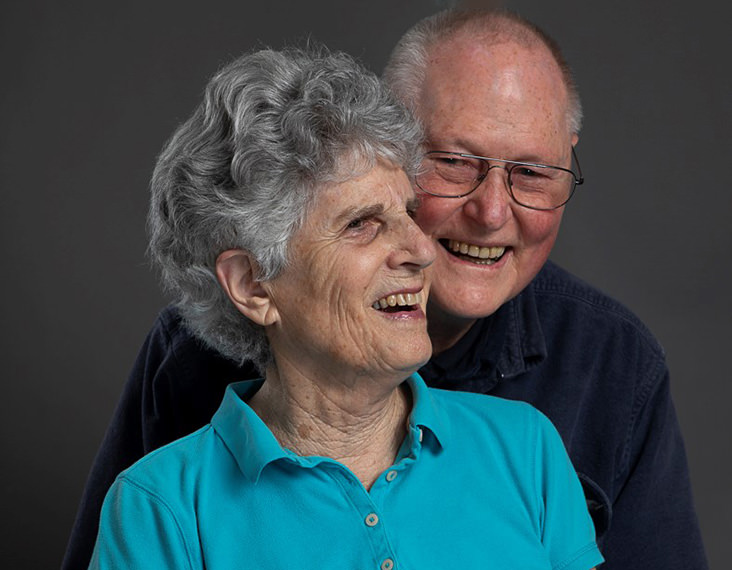 Elderly couple hugging