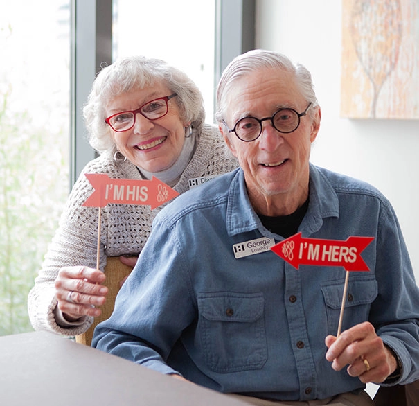 Elderly couple with signs