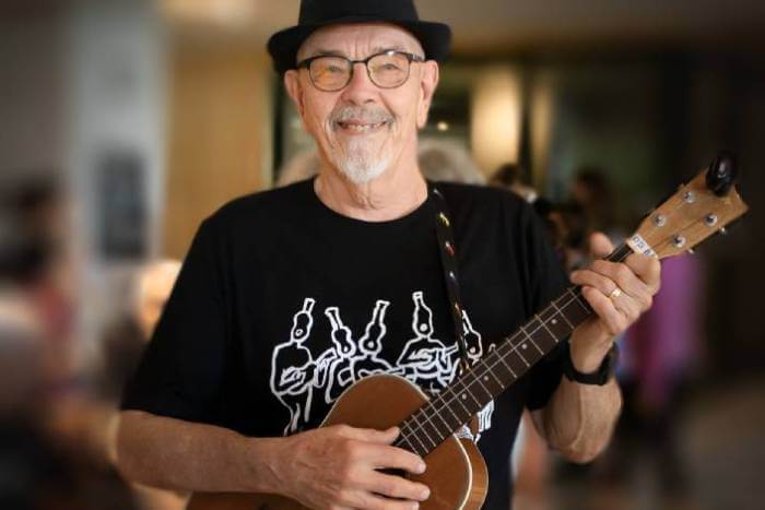 senior man playing music