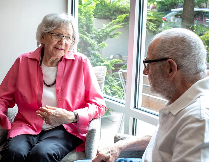 Senior woman and man talking