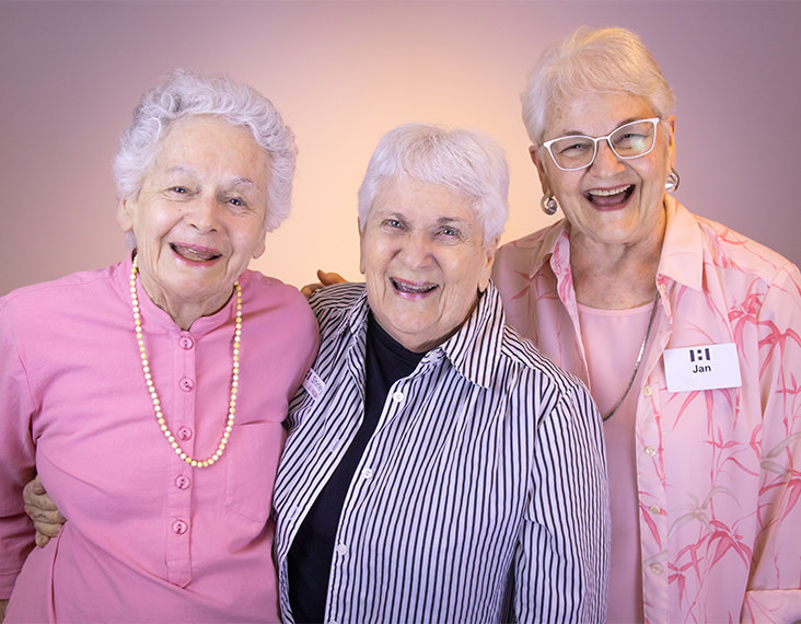Elderly sisters wearing pink